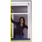 Bild des Windhager RhinoScreen Braun 130x160cm Fenstergitterrollos Bild einer Frau die durch ein Rollo-Fenster schaut
