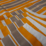 Bild des Windhager Sonnensegels in WeissGrauOrange